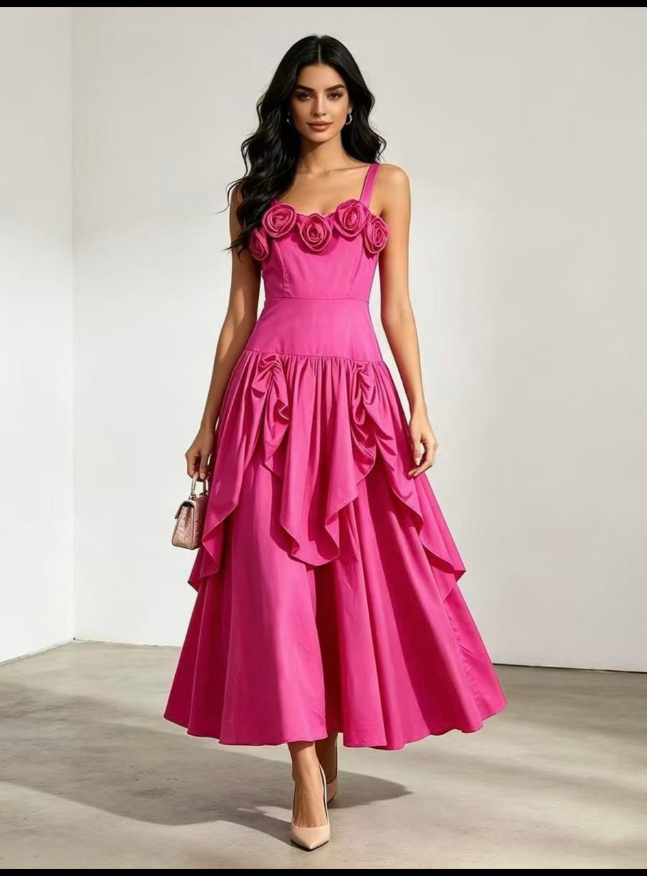A vivid pink dress with sculpted roses and a draped, full skirt